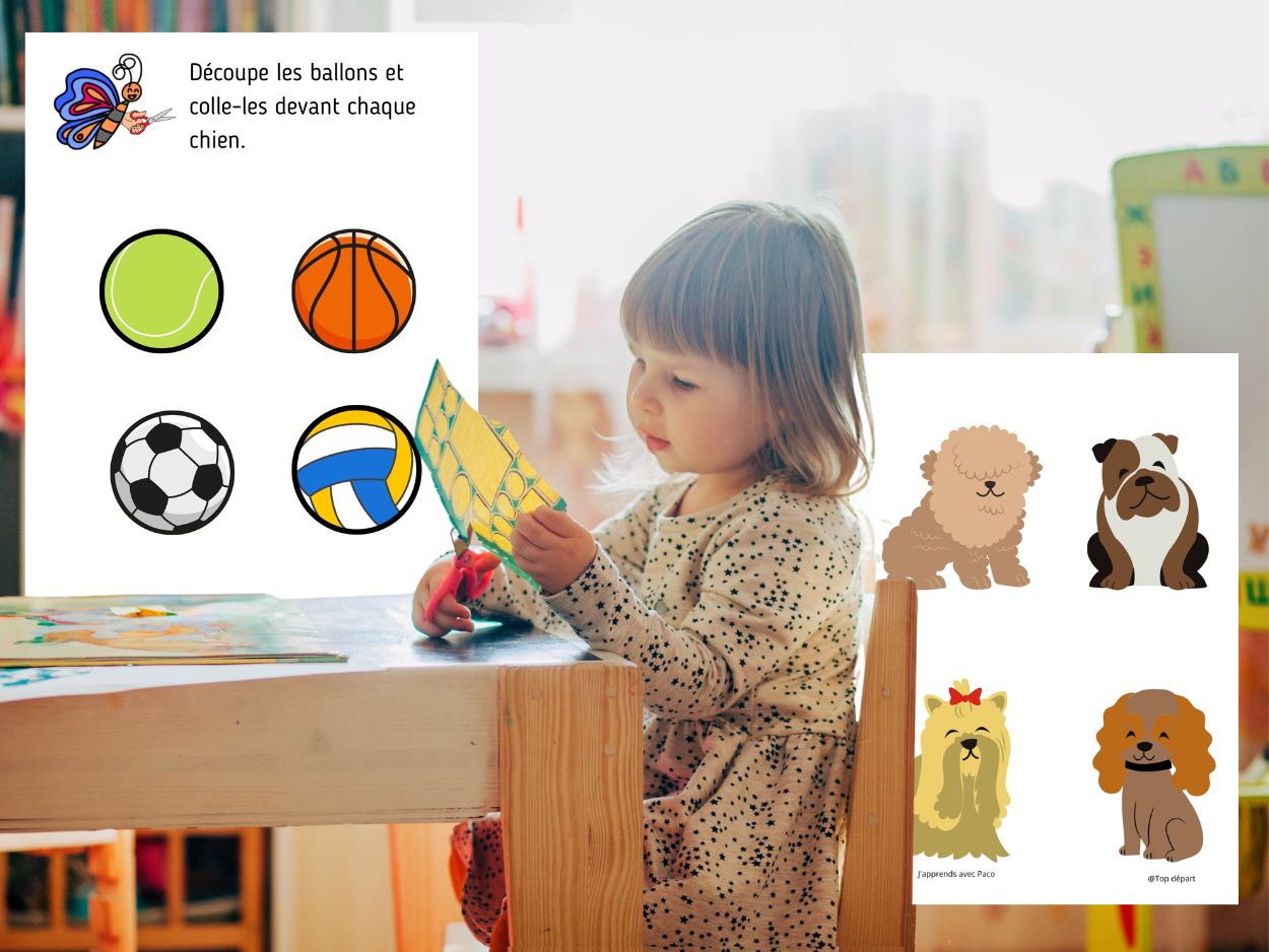 Petite fille concentrée découpant une planche d'étiquettes de ballons pour les coller devant des illustrations de différentes races de chiens.
